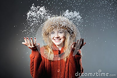 Young beautiful girl rejoices to snow Stock Photo