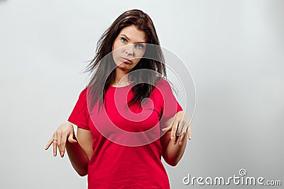 Young, beautiful girl, shows an emotion of disappointment, sadness, apathy. Isolated on a light background. Different human Stock Photo