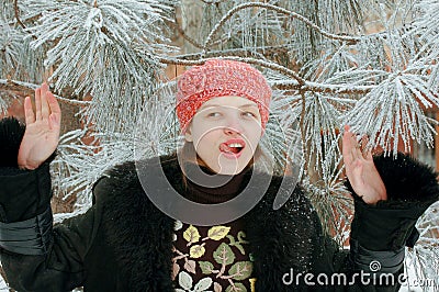 Young beautiful girl shows the photographer part her young body. A wolfskin jacket Stock Photo