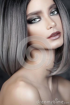 Young beautiful girl with silver make-up Stock Photo