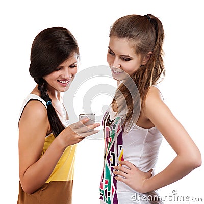 Young beautiful girls using the cellphone to send and receive sms Stock Photo