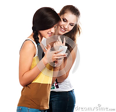 Young beautiful girls using the cellphone to send and receive sms Stock Photo