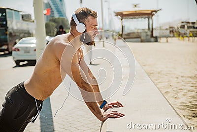 Young beautiful handsome man relaxing at the beach Stock Photo