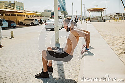 Young beautiful handsome man relaxing at the beach Stock Photo