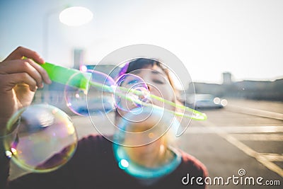 Young beautiful hipster woman bubble blower Stock Photo