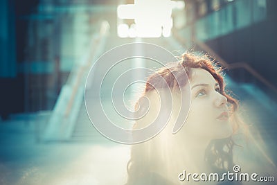 Young beautiful hipster woman with red curly hair Stock Photo