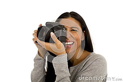 Young beautiful hispanic photographer woman smiling happy taking photo with reflex camera Stock Photo