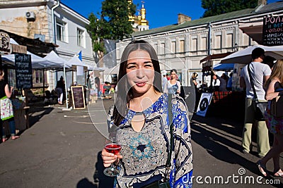 Young beautiful lady with glass of wine Editorial Stock Photo