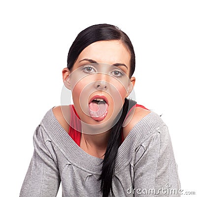 Young beautiful lady showing her tongue Stock Photo