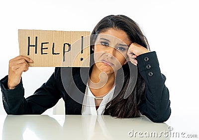 Young beautiful latin business woman overwhelmed and tired holding a help sign. looking Stressed, bored, frustrated, upset and Stock Photo
