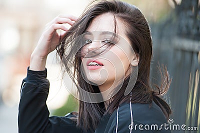 Young beautiful modern woman outdoors with expressive makeup Stock Photo