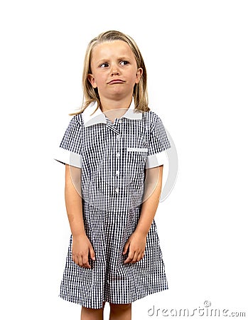 Young beautiful and moody schoolgirl in uniform looking tired bored and upset in frustrated face expression isolated on white Stock Photo