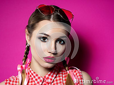 Young woman wearing heart shaped glasses Stock Photo
