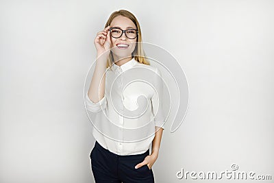 Young beautiful pleased blonde business woman in eyeglasses after successful business meeting isolated white background Stock Photo