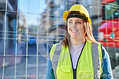 Young beautiful plus size woman architect smiling confident standing at street Stock Photo