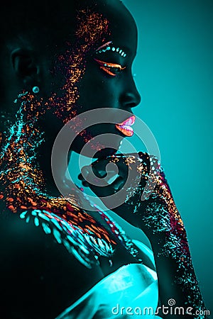 Young sensual woman in fluorescent paint makeup Stock Photo