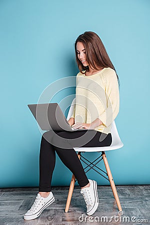 Young beautiful smart girl using laptop pc computer for study Stock Photo