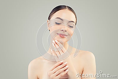 Young beautiful spa model girl with clear skin. Skin care, wellness and cosmetology Stock Photo