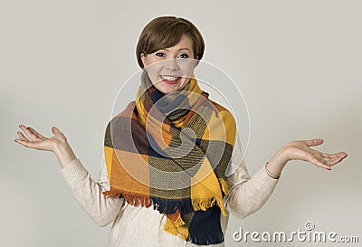 Young beautiful and stylish 30s red hair woman sweater and Autumn colorful scarf smiling happy Stock Photo