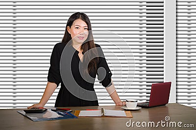 Young beautiful and successful Asian Korean business woman working confident at modern office computer desk in female businesswoma Stock Photo