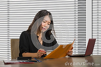 Young beautiful and successful Asian Korean business woman working confident at modern office computer desk in female businesswoma Stock Photo