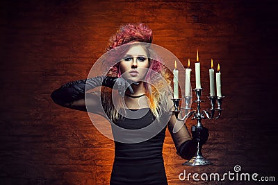 Young and beautiful witch making witchcraft Stock Photo