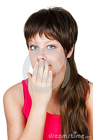 Young beautiful woman covering her mouth with her hand. isolated Stock Photo