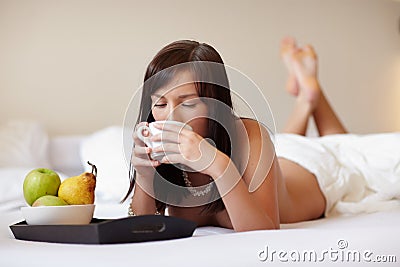 Young beautiful woman drinking coffee Stock Photo