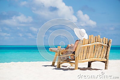 Young beautiful woman enjoying summer vacation, beach relax, sum Stock Photo