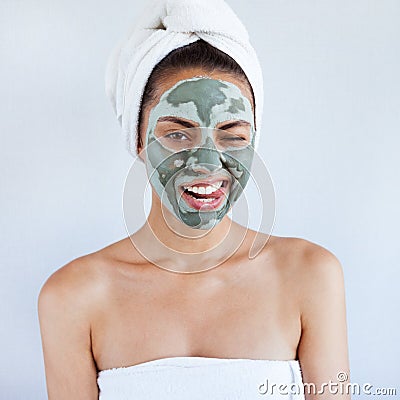 Young beautiful woman in face mask of therapeutic blue mud. Spa Stock Photo