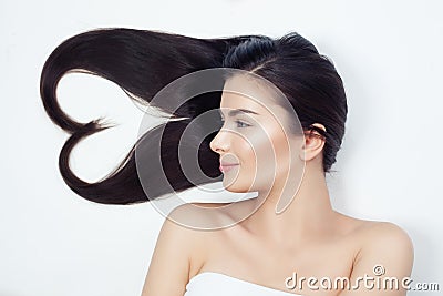 Young beautiful woman with healthy curly hair. Heart of hair, haircare concept Stock Photo