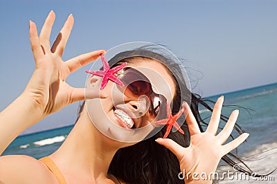 Young beautiful woman holding two starfish Stock Photo