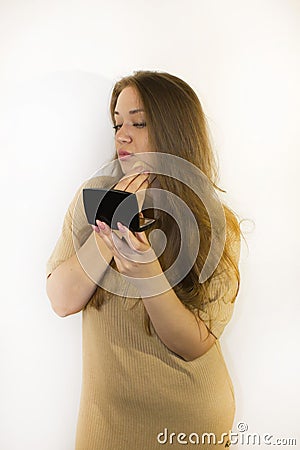 young beautiful woman with makeup, painted with powder, lipstick, mascara Stock Photo