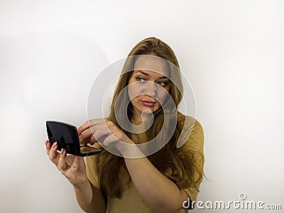 Young beautiful woman with makeup, painted with powder, lipstick, mascara Stock Photo