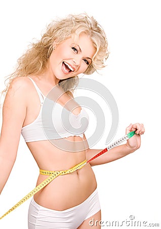 Young beautiful woman with measure tape Stock Photo