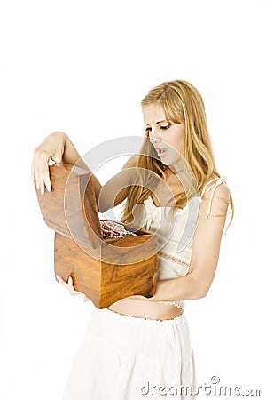 Young beautiful woman opening a wooden jewelry box Stock Photo