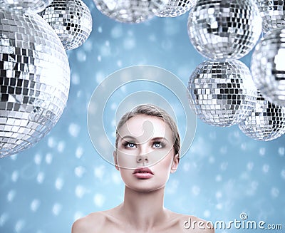 Young beautiful woman portrait with abstract mirror disco balls Stock Photo