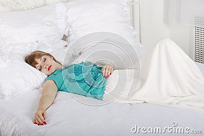 Young beautiful woman sleeps on bed Stock Photo
