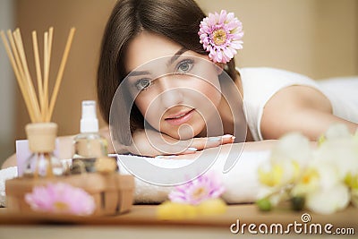 Young beautiful woman on the spa. Aroma oil and butter. Nice look. The concept of health and beauty. Better In the spa salon. Stock Photo