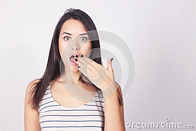 Young beautiful woman with surprised expression Stock Photo