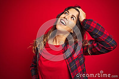 Young beautiful woman wearing casual jacket standing over red isolated background Pointing to both sides with fingers, different Stock Photo