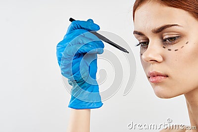 Young beautiful woman on a white background, facial contour, plastic surgery Stock Photo