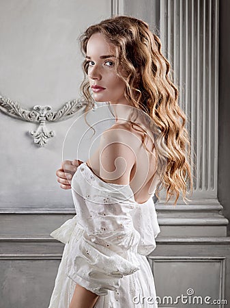 Young beautiful woman in a white baroque dress Stock Photo