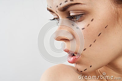 Young beautiful woman on white isolated background, portrait, plastic surgery Stock Photo