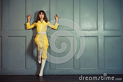 Young beautiful woman in yellow work suit Stock Photo