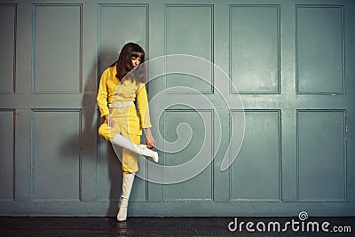 Young beautiful woman in yellow work suit Stock Photo