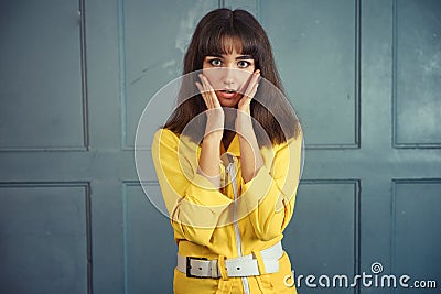 Young beautiful woman in yellow work suit Stock Photo