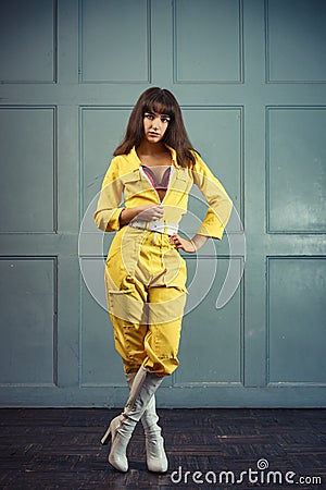 Young beautiful woman in yellow work suit Stock Photo