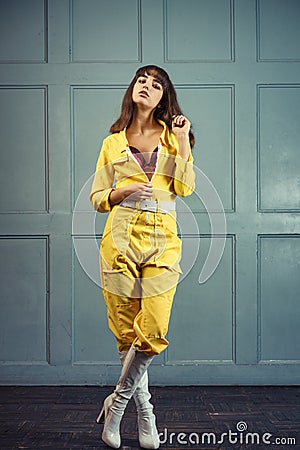 Young beautiful woman in yellow work suit Stock Photo