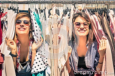 Young beautiful women girlfriends at the weekly cloth market Stock Photo